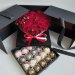 Букет с клубникой в шоколаде (20 ягод) и цветами в чёрной коробке